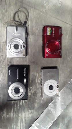 New Canon cameras 1 Olympus and one Nikon CoolMax 16 megapixel VR slide digital cameras