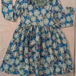 Tea, light blue floral print short-sleeved dress with a criss-cross back detail.size 10 girls