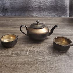 Teapot, milk jug and sugar bow
L