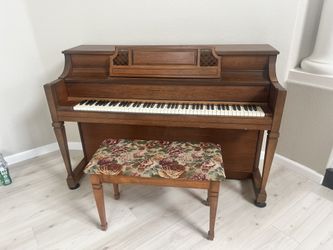 Vintage Hobart M. Cable upright acoustic piano, with an upholstered bench. $300 or best offer.