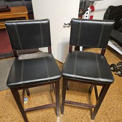 2 - Barstool Chairs . Black Seats , Wood Frame. Nice! $40 FOR BOTH