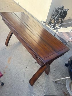 Solid wood console turns into dining table