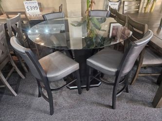 Brand new 48" x 36" round glass pub high dining table + 4 faux leather chairs with glitters