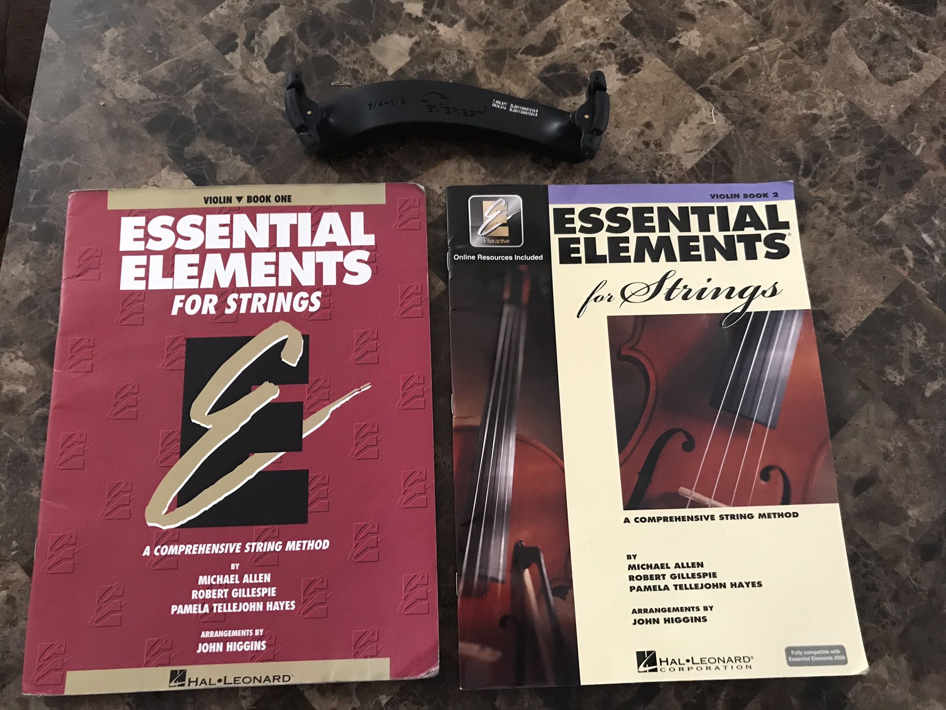 Violin books 1, 2 and violin shoulder rest.
