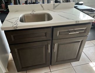 Kitchenette with sink and countertop ready for a studio, garage conversion