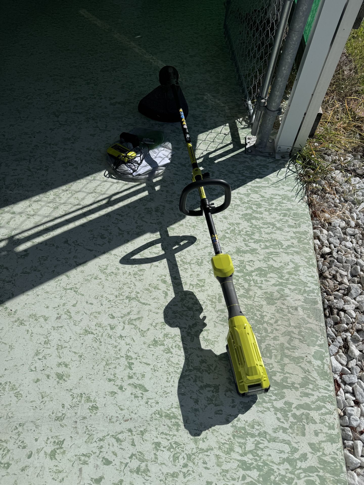 Ryobi 40 V lithium string trimmer, includes manual battery charger string. Only used a few times sold our house.