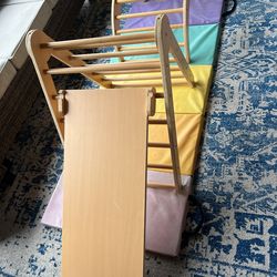 Toddler climbing wooden gym