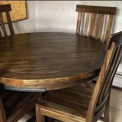 Round rustic dining table with chairs