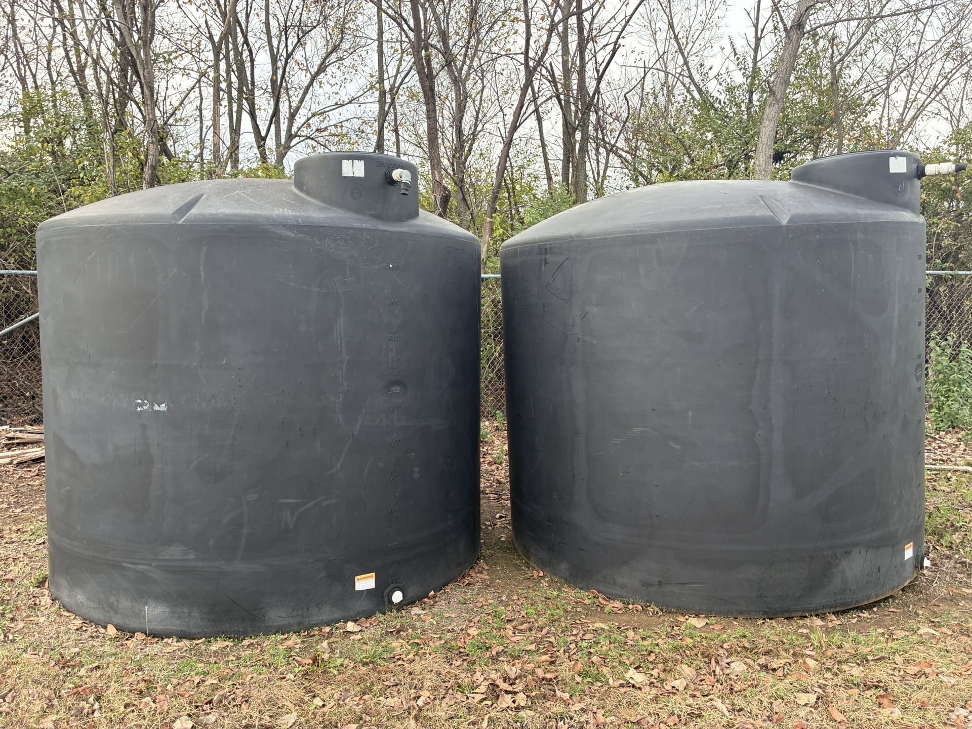 (2) 2500 Gallon Black Poly Water Tanks
