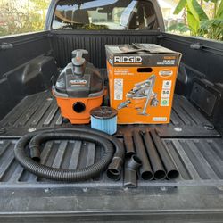RIDGID 4 Gal. 5.0 Peak HP Portable Shop Vacuum Wet Dry Vac with Fine Dust Filter, Locking Hose and Attachments WD4070