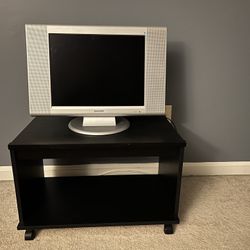 Small Blk TV Stand/book shelf on wheels (2) $65 each