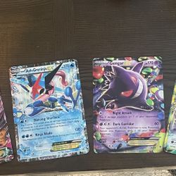 MAerodactyl Ex ,  Ash-Greninja Ex ,  Gengar Ex ,  and Mewtwo Ex Jumbo Oversized Pokemom Cards.