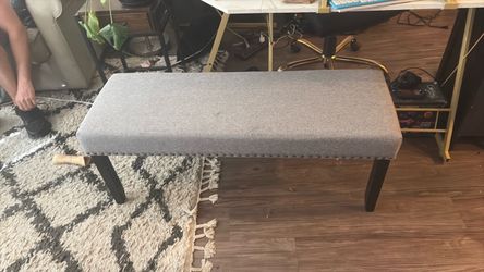 Gray studded ottoman