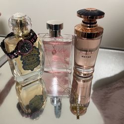 3 really cute perfumes with a watch and a cross