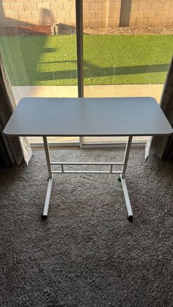 Adjustable desk/tabletop