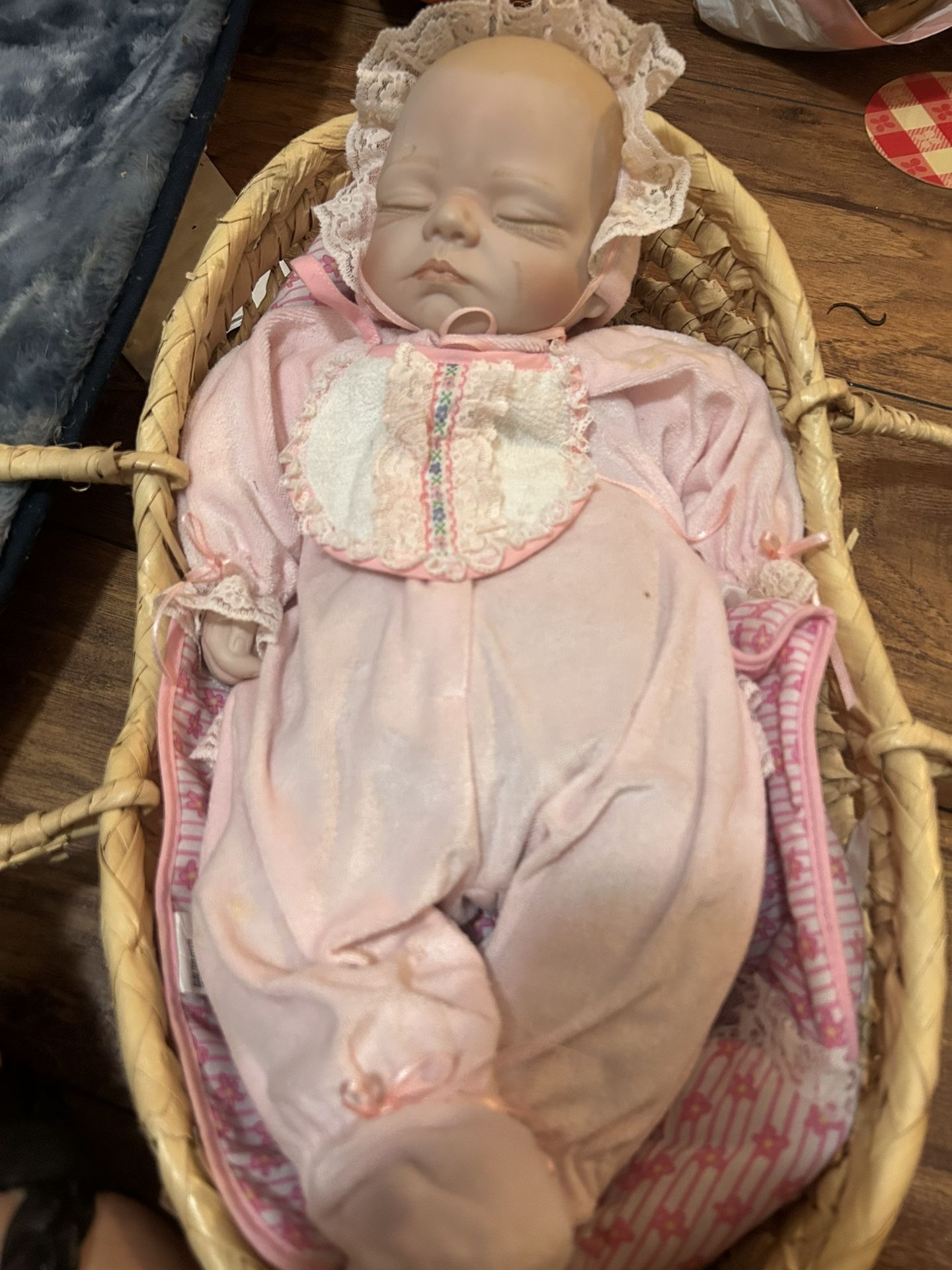 Doll In Basket