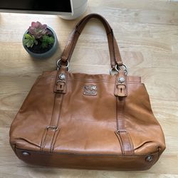 Madison Mia leather tote bag in a brown color. 