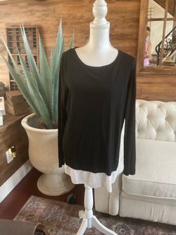 Black long sleeve blouse with white polka dot trim at the hem , Large