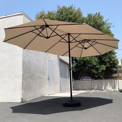 $115 (New) Large 15 ft double sided outdoor umbrella with 65 lbs plastic weight base (beige color) 