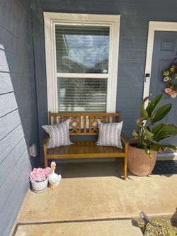 Patio bench with pillows