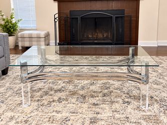 Glass-top coffee table with chrome frame