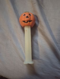 Title: Use a clear, searchable name like "Vintage 1980 Pumpkin PEZ Dispenser - Halloween Glow in the Dark".