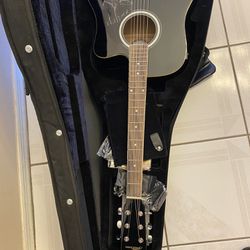 Brand New Electric Guitar With A Small Amp