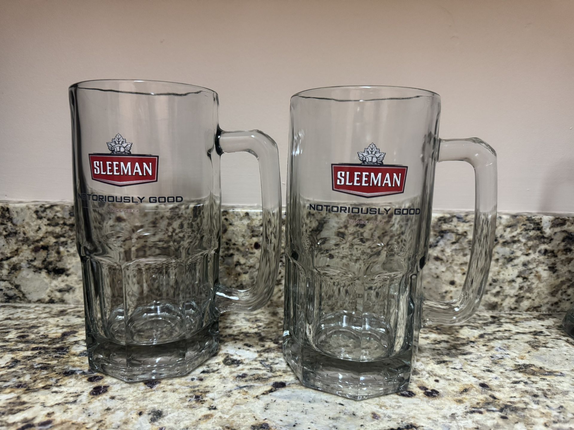 5 Sleemans beer glasses and 2 mugs