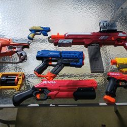 Eight Nerf Gun Toys