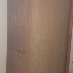 wooden bed with drawers and internal storage in the middle