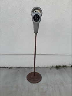 Vintage parking meter on heavy base stand