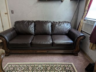 Leatherette sofa with wood trim