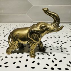 Vintage Taiwan solid brass elephant figurine 4” long x 3” tall  Has normal vintage patina and has not been polished Has original foil sticker 