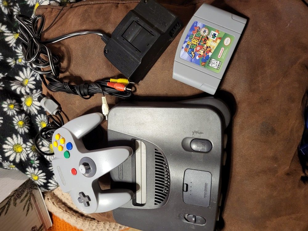 Nintendo 64 console with super mario 64 game , controller, av cord and power cord working perfectly