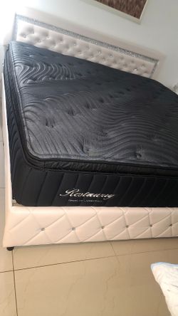 King size bed frame with stones  vinyl and almost new pillow top matress