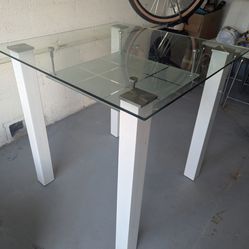 Glass table and white chairs