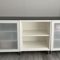 white TV stand with black glass