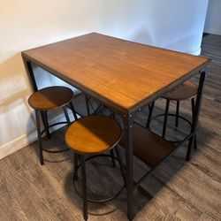 Table With Four Barstools  Includes A Wine Rack And Glass Holders