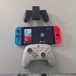 Nintendo  switch oled with controller and stand