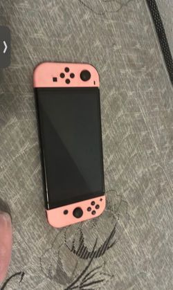 Nintendo switch with pink controllers good condition