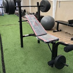 Gym Equipment Adjustable Bench press, barbell, leg developer and 100lbs of weight