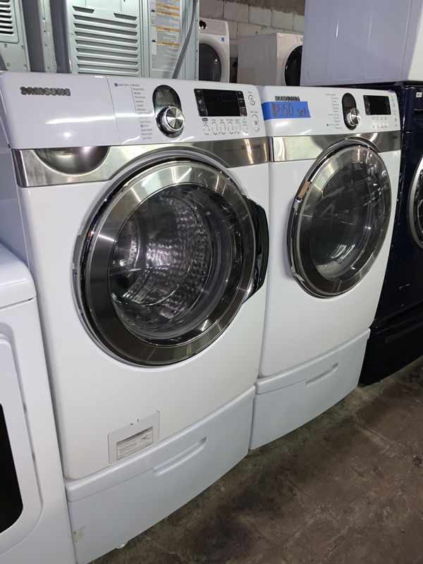 SAMSUNG front load washer & electric dryer w/ pedestals with in