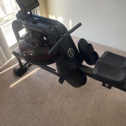 Sunny Health & Fitness Obsidian Surge 500 Water Rowing Machine – $300