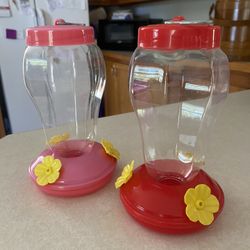 Two hummingbird feeders