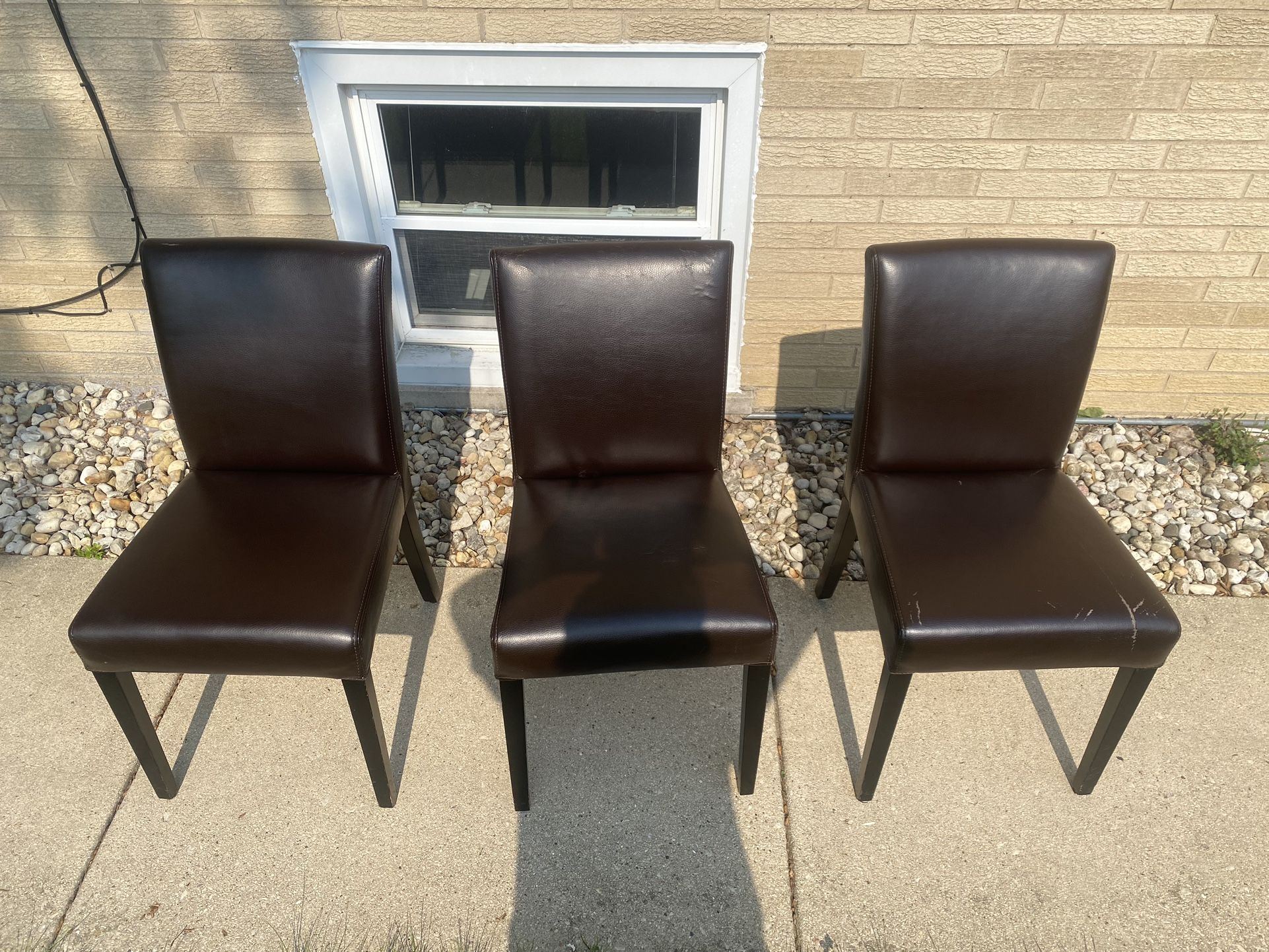 3 Brown leather chairs