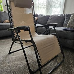 Tan Anti Gravity Lounge Chair With Pillow and Drink Tray