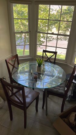 Glass round table with chairs