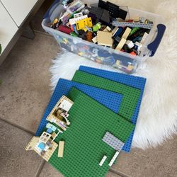 Box of lego Pieces With 4  Square Boards
