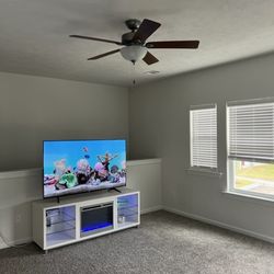 Entertainment Center With Fireplace And 65” TV