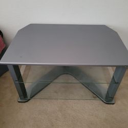 For sale $50 tv stand with nice glass shelves 